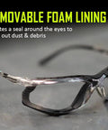 Foam Lined Debris Blocking Safety Glasses With Anti Fog UV Protection ANSI Z87.1 featuring removable foam lining on a table.