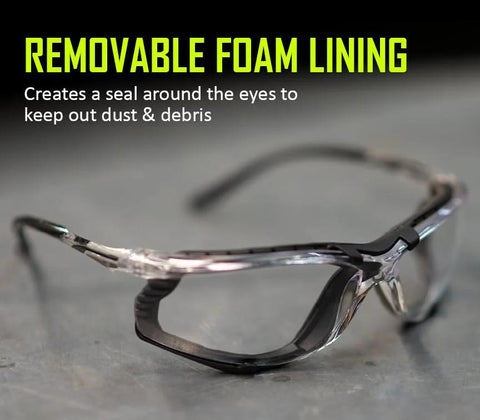 Foam Lined Debris Blocking Safety Glasses With Anti Fog UV Protection ANSI Z87.1 featuring removable foam lining on a table.