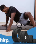 Man using density foam roller with built in spine channel for targeted back and neck relief, 4-pack shown below