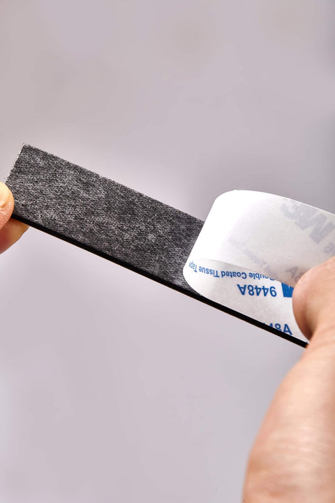 Heavy Duty No Fuss Double Sided Foam Tape Kit with Waterproof Adhesive Mounting Tape being peeled, showing adhesive backing