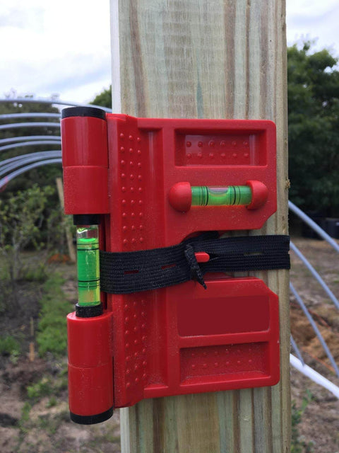 2 Pack Folding Magnetic Post Level For Pipe Post And Beams Leveling, Foldable tool with magnetic strips and vials on a wooden post.