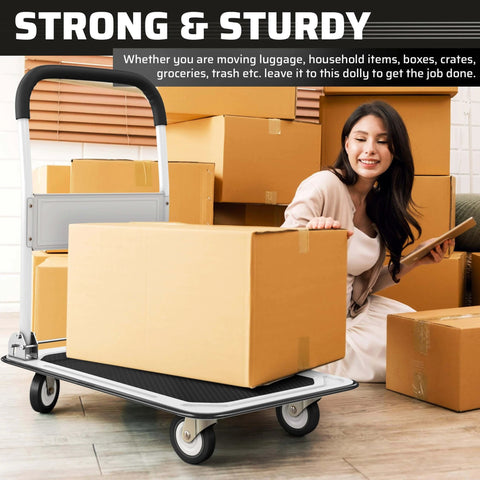 Heavy Duty Foldable Push Cart Dolly with 330 lbs. Capacity in use with cardboard boxes, woman seated nearby