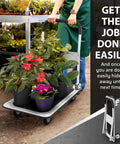 Person using Heavy Duty Foldable Push Cart Dolly | 330 lbs. Capacity | Upgraded Collapsible Hand Truck with plants on platform