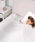 Foldable Toddler Bed Rail With Safe Bumper And Flap Non Slip Machine Washable Cover Portable Toddler Bed Rails For Kids Fits Twin Beds One Pack Easy Guardrail For Early Bed Transition And Sleep Safety installed on bed with sleeping child.