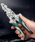 Hand holding Foldable Automatic Wire Stripper And Cutter With 18 In 1 Wire Crimping Tool, compact and multifunctional design.