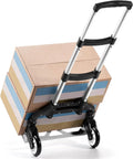 Folding aluminum hand truck cart 180 lb capacity portable travel dolly loaded with boxes on telescoping handle