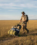 Man using ✝️ Folding Hand Truck and Dolly with camping gear in field
