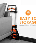 Dolly Cart, 309 lb Aluminum Folding Hand Truck with Swivel Handle folded beside sofa, easy storage, 7 inch wheels visible.