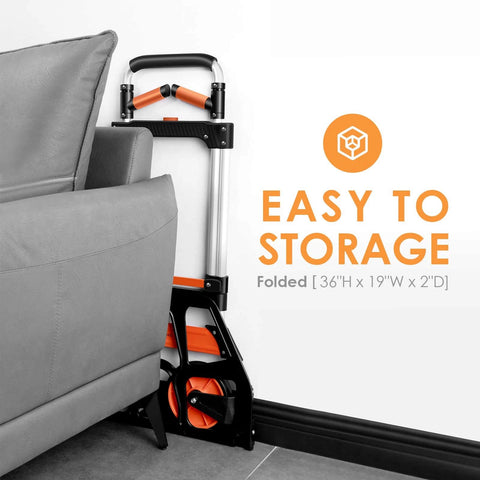 Dolly Cart, 309 lb Aluminum Folding Hand Truck with Swivel Handle folded beside sofa, easy storage, 7 inch wheels visible.