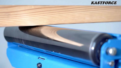Close-up of a folding roller stand with a wooden plank, highlighting the heavy duty 300 LB load capacity, model KF3015 for smooth motion.