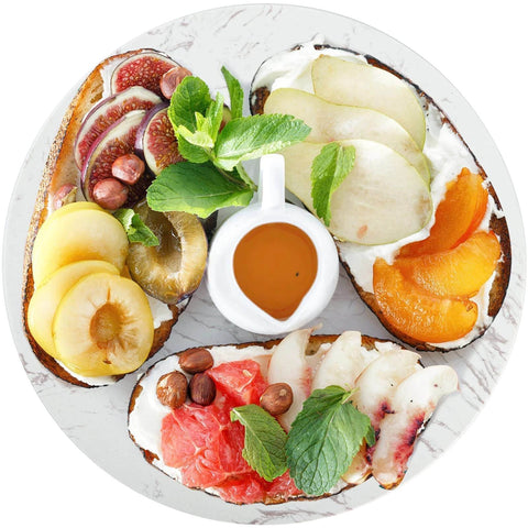 Marble lazy susan turntable designed as a cheese board and cake stand, 12 inch natural white marble rotating tray with fruit toppings.