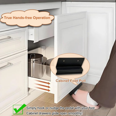 Person using a Pack Of Two Hands Free Cabinet Foot Pulls For Touchless Trash Drawers And Full Overlay Cabinets With Toe Kick Activation Soft Rubber Pedal For Barefoot Use Easy To Install With Adhesive Or Screws in kitchen. Close-up of foot pushing pedal to open cabinet drawer.