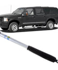 Bilstein 5100 Series Rear Shock Absorber for 2000 to 2005 Ford Excursion with 3 to 5 inch rear lift; vehicle in background