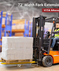 72-inch forklift extensions lifting a pallet, part of a Heavy Duty Forklift Extensions 72 Inch Long And 4.5 Inch Wide Pack Of Two product.
