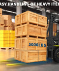 Forklift using boosts your forklift reach with 72 inch extensions, 5500 lbs capacity, 5.5 inch wide, heavy duty pallet fork extenders, lifting 5000 lbs crates in warehouse.
