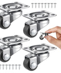 Four Pack Half Inch Low Profile Caster Wheels With Rubber Rollers for furniture, shown with screws and hand for size reference.