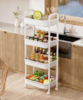 Four Tier Rolling Cart With Wheels For Kitchen Office Bedroom And Craft Storage Lightweight Yet Sturdy Utility Cart On Locking Casters White Perfect Go To Diaper Snack Tool Organizer For Home Use in kitchen setting with supplies.