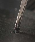 Close-up of Framework Mini 11 In 1 Multitool Open Frame using Phillips screwdriver on screw