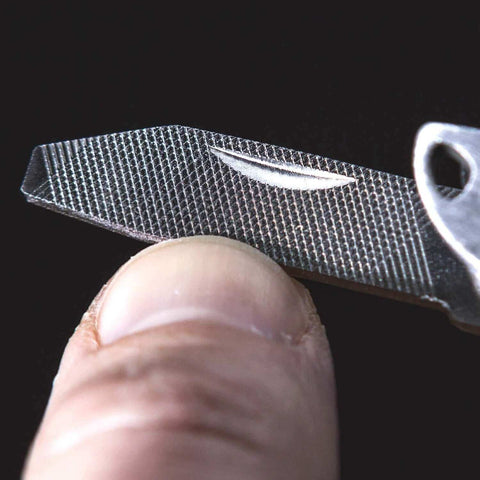 Close-up of Framework Mini 11 In 1 Multitool's textured knife blade, part of the compact open frame multitool with key ring.