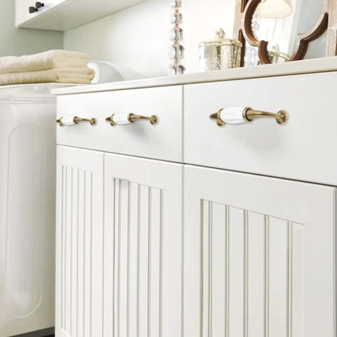 French Style White Ceramic Cabinet Handle Set Of 2 With Zinc Alloy Pulls And Screws For Cupboards Wardrobe Drawers And Dresser Retro Furniture Hardware With 3.7 Inch Center To Center Spacing installed on white cabinet drawers.