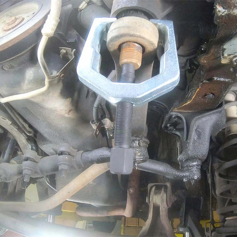 26554 Front End Service Kit in use, showing Pitman Arm Puller on vehicle suspension for maintenance and repair