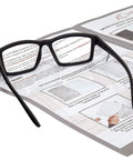 Full Lens Reading Safety Glasses 1.5 Diopter ANSI Z87.1 CE EN166F Anti Fog UV400 resting on instruction sheets