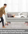 Man pushing a sofa on 360 Degree Rotatable And Lockable Furniture Dolly With Five Wheels Rubber Silent Sliders, 3300 Lbs Load Capacity