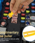 Hand using a yellow fuse puller to remove a fuse, part of the Ultimate Car Fuse Kit With 680 Mini Fuses 520 Standard Fuses And 132 Micro Fuses With Puller For RV Camper Truck Motorcycle Yacht 11 Amp Sizes From 2A To 40A For Quick Auto Electrical Fixes.
