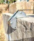 Tackle Pulley System for Lifting with Rope installed on concrete edge, showcasing heavy-duty steel frame and dual wheels.