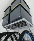 96 Inch Wide Wall Mounted Utility Storage Rack With 4 Bike Hooks And 20 Regular Hooks in use with bikes and storage bins in garage