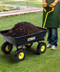 Heavy Duty Garden Dump Cart Utility Wagon with 600 LB Capacity 4 Cu Ft Bed shown hauling soil on grass