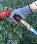 Person watering plants with Heavy Duty Built Tough Three Quarters Inch Full Flow Garden Hose Quick Connect Fittings Lead Free Brass Full Port Connectors Coupler For Five Eighths And Three Quarters Inch Hoses GHT High Volume Quick Release Adapter Professional Grade.