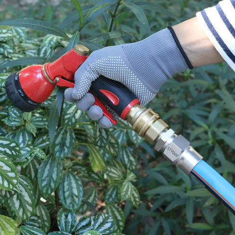 Person watering plants with Heavy Duty Built Tough Three Quarters Inch Full Flow Garden Hose Quick Connect Fittings Lead Free Brass Full Port Connectors Coupler For Five Eighths And Three Quarters Inch Hoses GHT High Volume Quick Release Adapter Professional Grade.