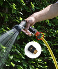 Twelve Piece Three Quarter Inch Garden Hose Quick Connectors Set With Six Male And Six Female Fittings And Six Rubber Washers Easy Connect Fits Standard Garden Hoses being used in a garden setting