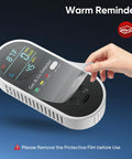 Hand peeling off protective film from 4 in 1 Plug In Gas and CO Detector with Temperature and Humidity Sensors, displaying screen.