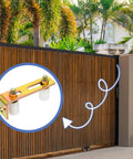 Adjustable Slide Gate Guide Roller Kit 4 Pack with Dual Nylon Rollers and L Rear Post Bracket installed on a wooden sliding gate