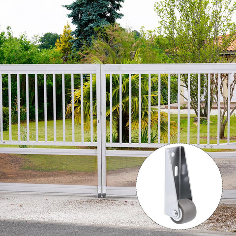 4 Piece Set Small 1 Inch Side Mount Caster Wheels For Furniture And Doors Low Profile Gate Casters in front of a garden gate