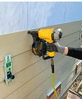 Installing fiber cement siding with Aluminum Gecko Gauge offers precise height and spacing, showing mounted tool holding boards steady.