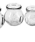 Pro Grade Glass Fire Cupping Jars Set With Four Sizes, Extra Thick Medical Grade Glass With Finger Grips, displayed in a row