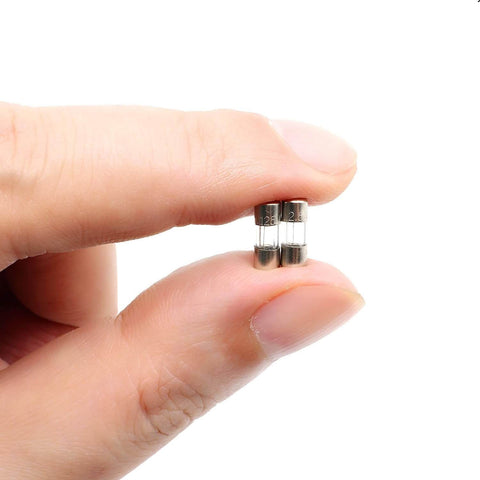 Person holding Fast-Blow Mini Fuse F2.5AL, 2.5A 125V Glass Fuse, 10 Pack, 0.39 x 0.14 Inch (10 x 3.6 mm), showing compact size.