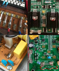 Must-Have Glass Fuse Kit With Fast Blow Fuses in use in electronic circuits and repairs showcasing various circuit boards