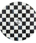 Top view of Mackenzie-Childs Glass Lazy Susan 360 Degree Rotating Serving Board In Black And White Courtly Check pattern.