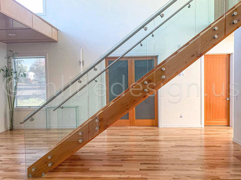 Stainless Steel Glass Clamp Standoffs Round Large Heavy Duty 2 Inch Inline Design installed on indoor staircase with wooden handrail.