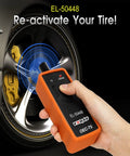 Hand holding GM TPMS Relearn Tool for 2006-2024 Chevy Buick GMC Opel Cadillac Vehicles 315/433 MHz near tire