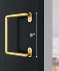 National Hardware N700-105 Interior Sliding Barn Door Troy Pull 8 Inch Brushed Gold Finish on black door