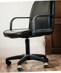 Black office chair with Gold Ball Caster Wheels Set 5 Pieces For Desk And Office Chairs, smooth rolling on hardwood floor.