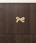 Gold Bow Knobs For Dresser Set Of 4 Brass Drawer Knobs installed on a dark wood cabinet drawer, decorative vintage gold handles
