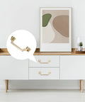 Gold Brushed Cabinet Handles Pulls Set Of 4 Zinc Alloy Drawer Knobs installed on modern white cabinet in living room.