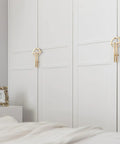 2 Pack Gold Zinc Alloy Cabinet Pulls on white closet doors showcasing modern minimalist design for office furniture renovation