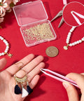 24K Gold Plated Chip Solder 2x2mm with jewelry tools, pearl bracelets, and pink tweezers on red background